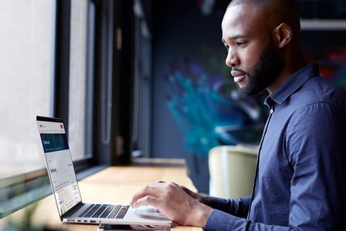 Laptop user browsing ARC campus